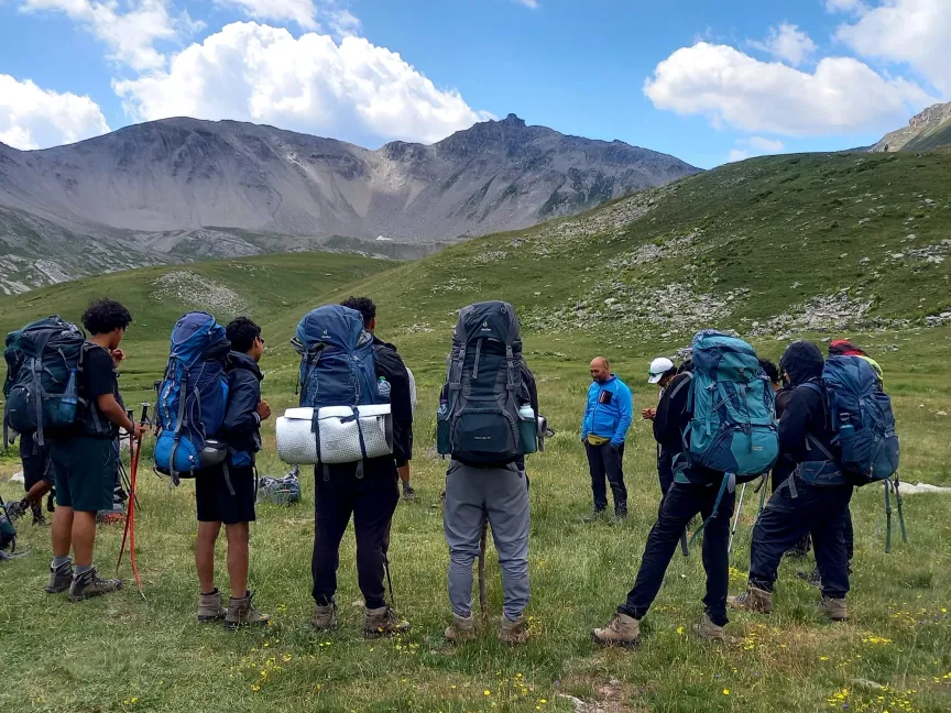 People with backpacks in the mountains